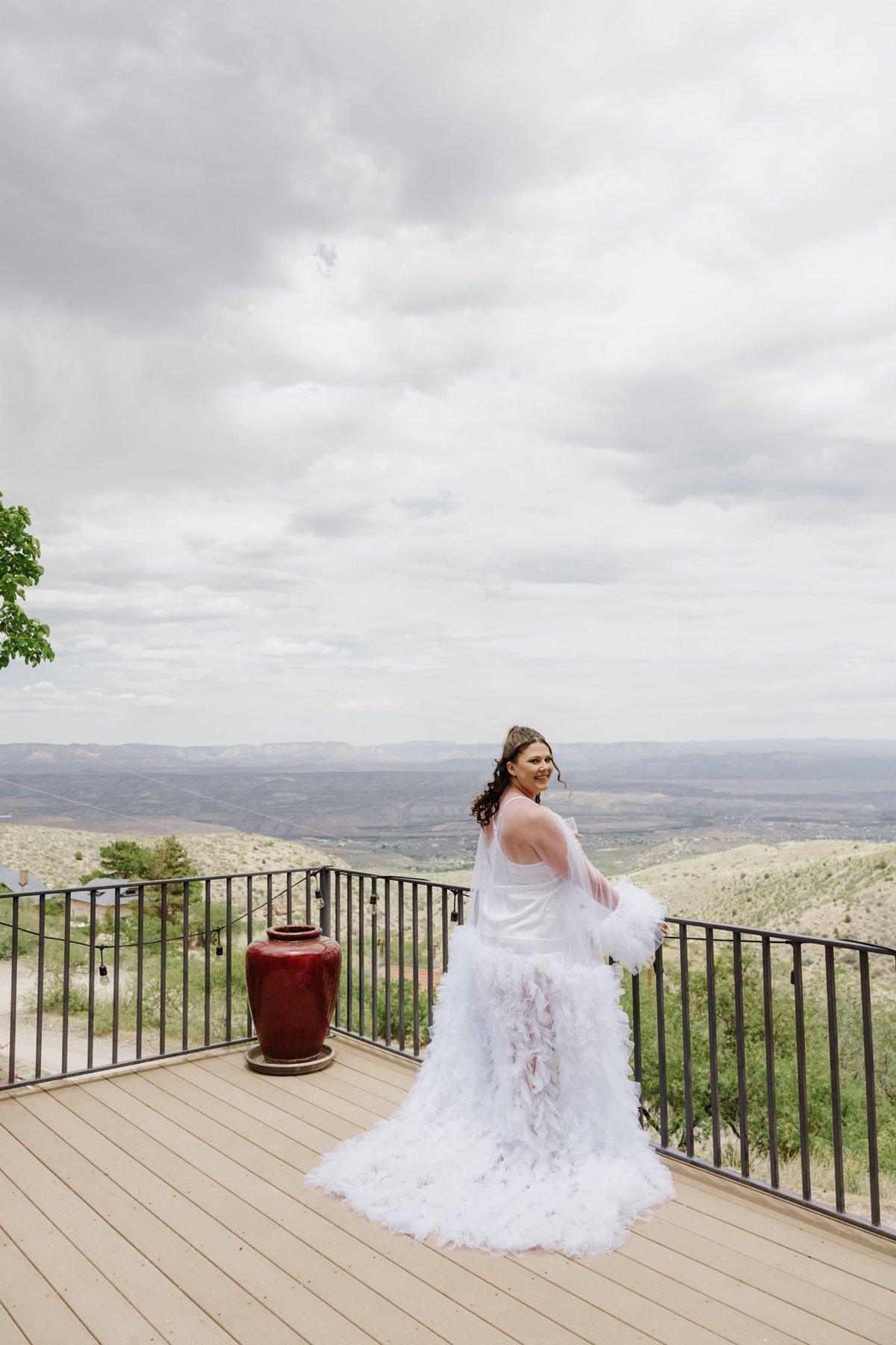 Abigail in a feather-trimmed robe on the terrace overlooking the Verde Valley