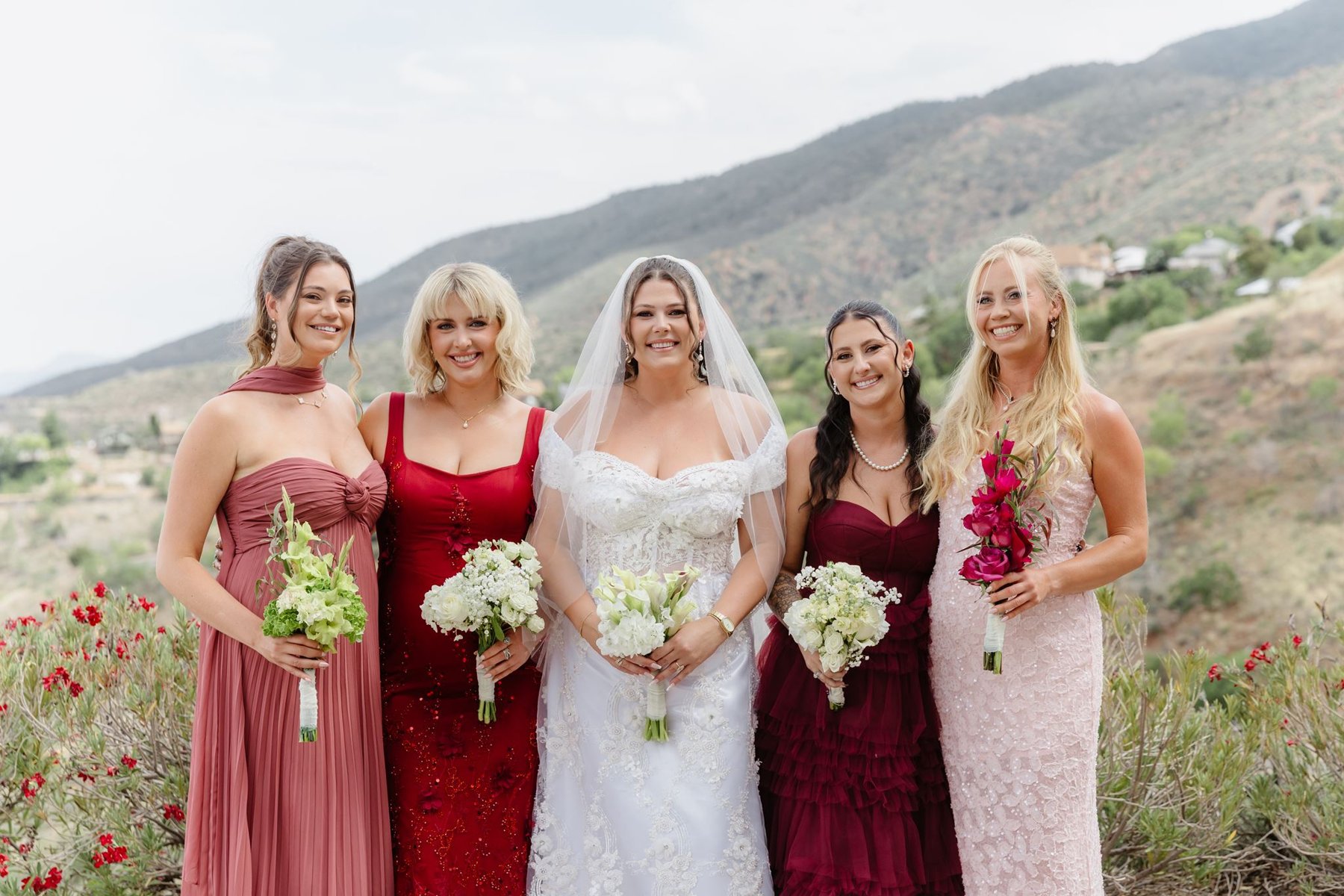 Abigail and her bridesmaids with the Jerome hills behind them