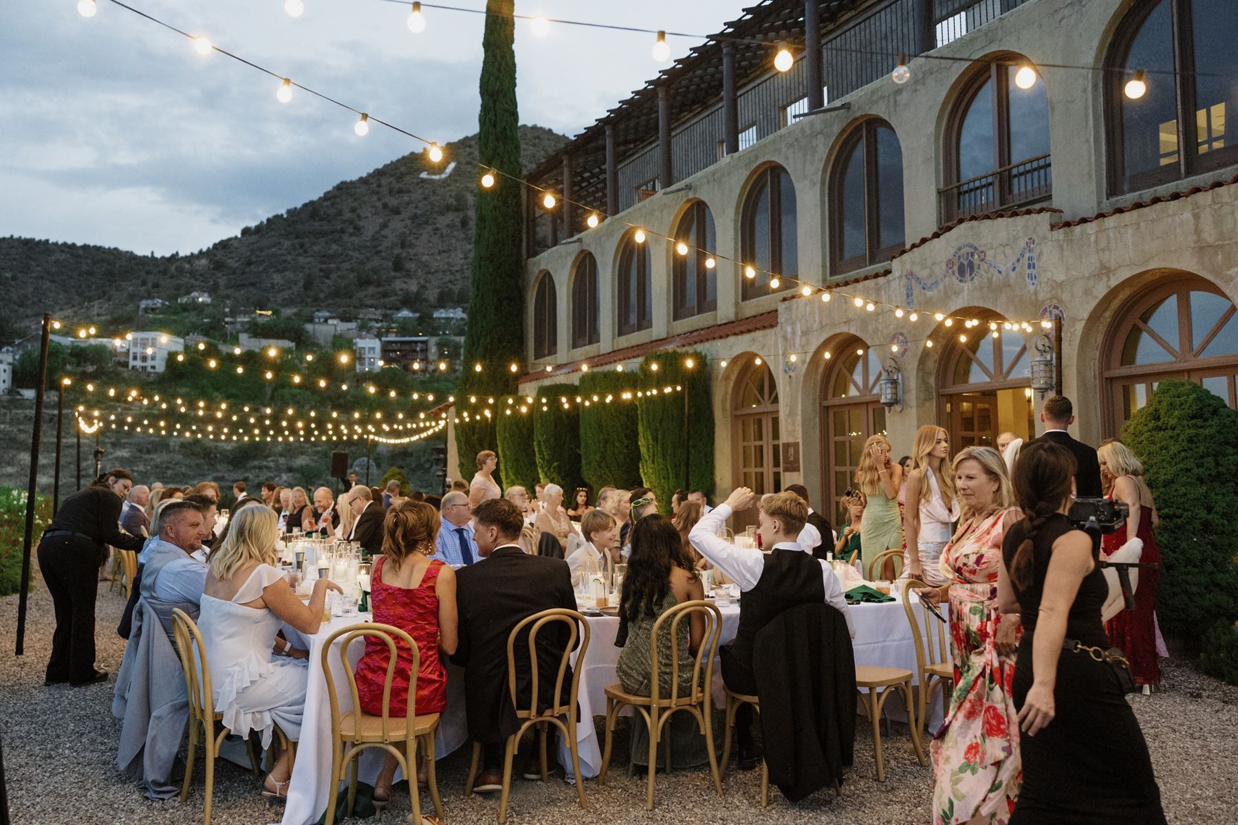 Outdoor wedding reception at The Little Daisy Jerome as evening falls