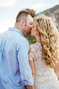 bride-groom-kissing-windy-day